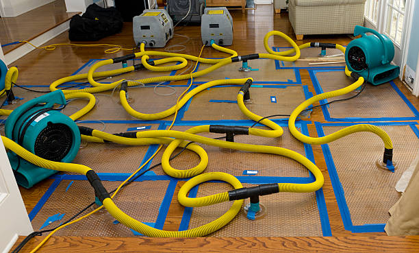 Professional Flood Damage Restoration technician working in New Boston, NH